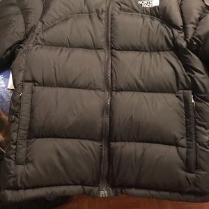 Woman’s size small black North Face coat.